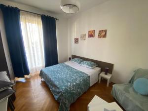 a small bedroom with a bed and a window at ToPlay! in Turin