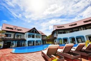 a resort with lounge chairs and a swimming pool at Kunigami-gun - Hotel / Vacation STAY 11195 in Onna