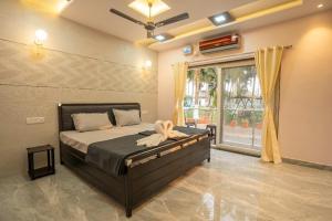 Ένα ή περισσότερα κρεβάτια σε δωμάτιο στο SAI 4BHK VILLA ALIBAUG +36 φωτογραφίες