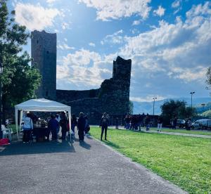 a group of people standing under a tent in front of a castle at Da Benedetta in Cantagrillo