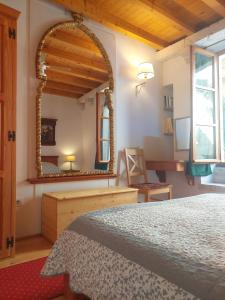 a bedroom with a bed and a large mirror at Apartment Korcula Town in Korčula