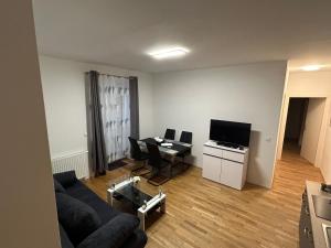 TV a/nebo společenská místnost v ubytování Paky Appartements 00322