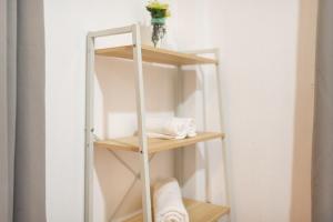a ladder shelf in a bathroom with towels on it at Garden Home 3 in Haad Yao