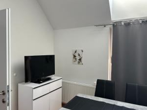 TV a/nebo společenská místnost v ubytování Paky Appartements 00323
