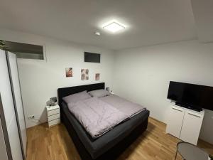 Postel nebo postele na pokoji v ubytování Paky Appartements 00323
