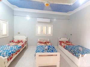 Un ou plusieurs lits dans un hébergement de l'établissement Winji Guest house
