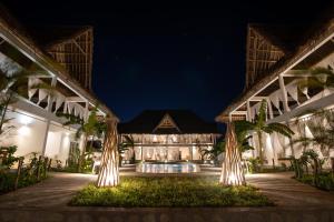 an exterior view of a resort at night at Rafiki Tamu Residential Resort in Watamu