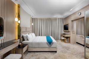 Кровать или кровати в номере Faraj Almadina Hotel
