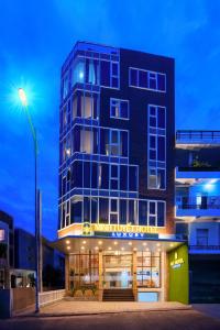 a building with a street light in front of it at Minh Tuyết Luxury Hotel in Nha Trang