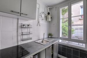 A cozinha ou cozinha compacta de Magnifique Appart Rénové Paris Métro 4pers Wifi
