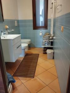 a bathroom with a sink and a toilet at Casa Paolina in Cefalù