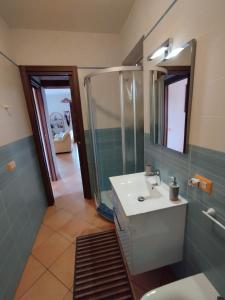 a bathroom with a sink and a mirror at Casa Paolina in Cefalù