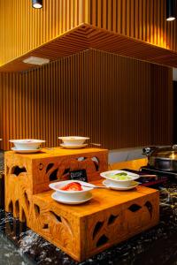 a table with bowls of food on top of it at Best Western Dodoma City Hotel in Dodoma