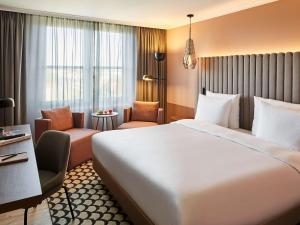 Łóżko lub łóżka w pokoju w obiekcie Pullman Stuttgart Fontana