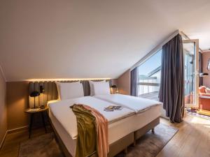 Łóżko lub łóżka w pokoju w obiekcie Pullman Stuttgart Fontana
