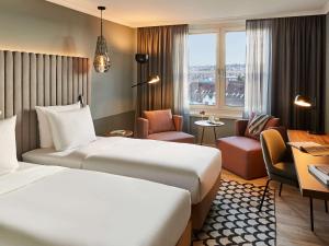 Łóżko lub łóżka w pokoju w obiekcie Pullman Stuttgart Fontana