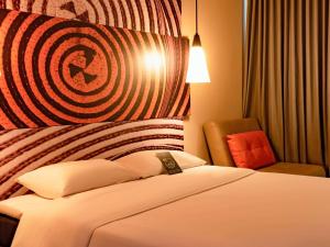 Postel nebo postele na pokoji v ubytování ibis Apartado