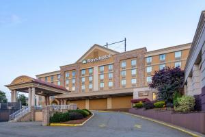 a rendering of the front of a hotel at Days Hotel by Wyndham North Bergen in North Bergen