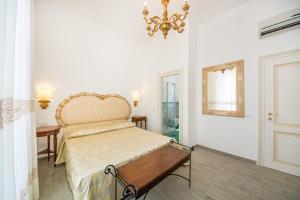 En eller flere senge i et værelse på Relais San Giacomo