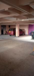 two cars are parked in a parking garage at TRANGQUIL APARTMENTS in Kitengela 