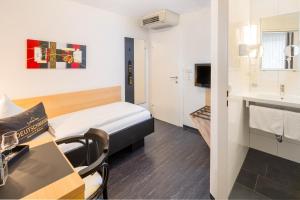Postel nebo postele na pokoji v ubytování 4-Länder-Hotel Deutschmann