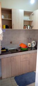 a kitchen with a sink and a counter top at TRANGQUIL APARTMENTS in Kitengela 