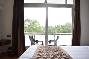 Voodi või voodid majutusasutuse Hotel NT Grand Yercaud toas