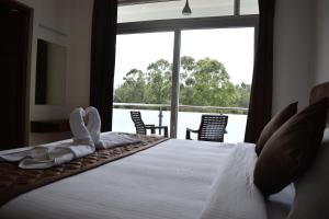 Voodi või voodid majutusasutuse Hotel NT Grand Yercaud toas