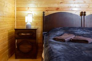 Postel nebo postele na pokoji v ubytování Cosy Kvara77