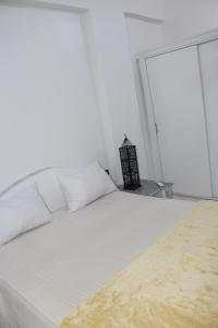 Postel nebo postele na pokoji v ubytování Mama Africa Apts & Studios