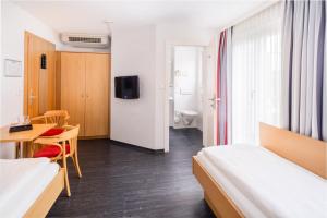 Postel nebo postele na pokoji v ubytování 4-Länder-Hotel Deutschmann