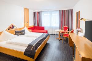 Postel nebo postele na pokoji v ubytování 4-Länder-Hotel Deutschmann