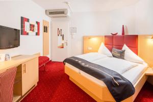 Postel nebo postele na pokoji v ubytování 4-Länder-Hotel Deutschmann