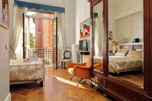 Postel nebo postele na pokoji v ubytování Domus Monamì Luxury Suites