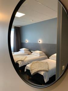 Postel nebo postele na pokoji v ubytování Centrum Hotel Viljandi