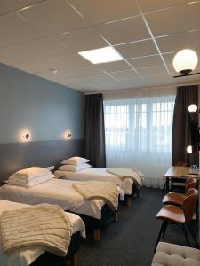 Postel nebo postele na pokoji v ubytování Centrum Hotel Viljandi