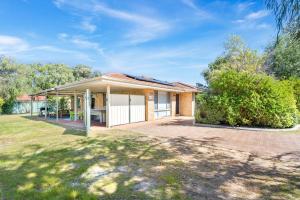 a home in the suburbs with a yard at Busselton Family Holiday House - by the Bay in Geographe