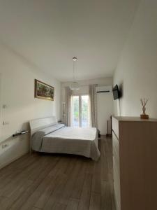 A bed or beds in a room at Appartamento Noi Due