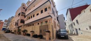 a truck parked in front of a building at Riad Dar Haven in Tamraght Ou Fella