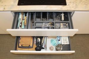 a drawer filled with utensils in a kitchen at Casa dos Amigos - Arouca in Arouca