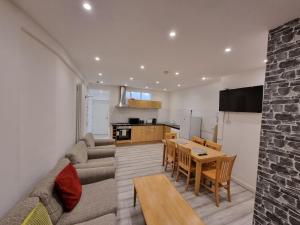 a living room with a couch and a table at Entire Flat with Three Bedrooms N 2 in Great Yarmouth