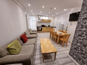 a living room with a couch and a table at Entire Flat with Three Bedrooms N 2 in Great Yarmouth