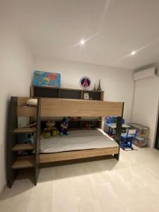 a bedroom with a bunk bed in a room at Villa de prestige in Saint-Paul