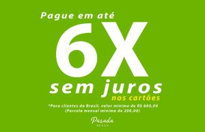 Zielony plakat ze słowami san junos w obiekcie Parada Beach Beira-Mar e Aptos 70m do Mar w mieście Florianópolis