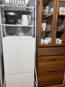 a refrigerator with its door open in a kitchen at えん吉野絶景広がる隠れ家1棟貸切ペットokサウナ室完備 in Yoshino