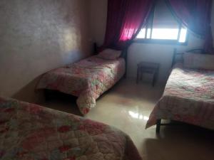 Katil atau katil-katil dalam bilik di Maison de fatima