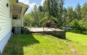 a deck on the side of a house at Amazing Home In Herräng With Wifi in Herräng