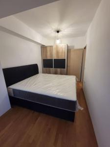 a bedroom with a bed in a room at Brand new apartment in Downtown Gevgelija in Gevgelija