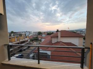 a balcony with a view of a city at Brand new apartment in Downtown Gevgelija in Gevgelija