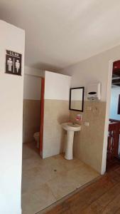 a bathroom with a sink and a toilet at Killa Wasi B&B in Chachapoyas